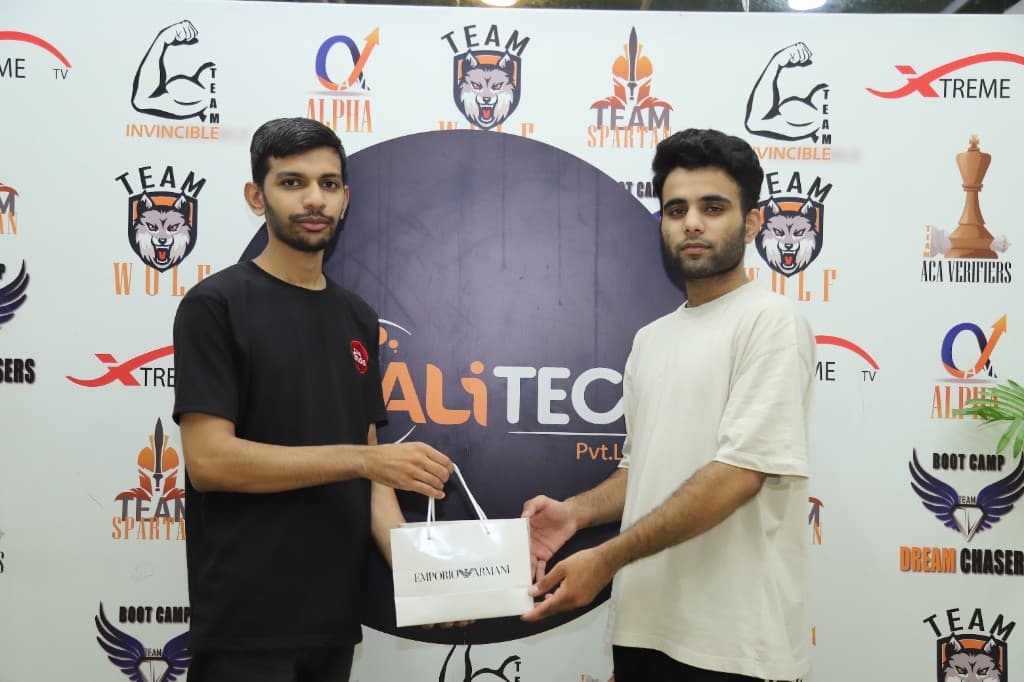 BALITECH top performer receiving Emporio Armani gift