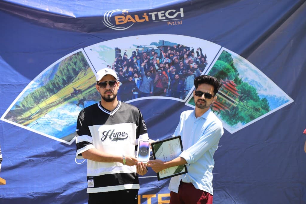 BALITECH employee receiving iPhone and certificate award